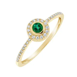 Bague en or jaune sertie de diamants et d'une emeraude de synthse