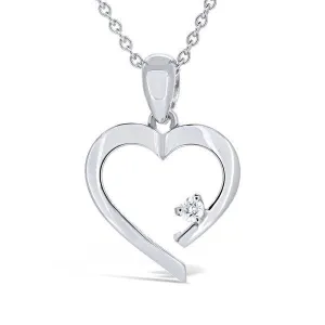 Pendentif coeur en or blanc serti d'un diamant.