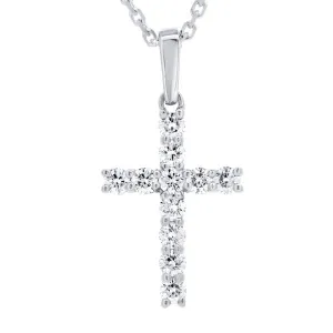 Pendentif croix en or blanc serti de diamants.