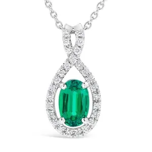 Pendentif en or blanc serti de diamants et d'une meraude de synthse.