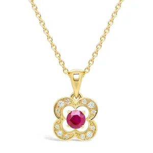 Pendentif en or jaune serti de diamants et rubis.