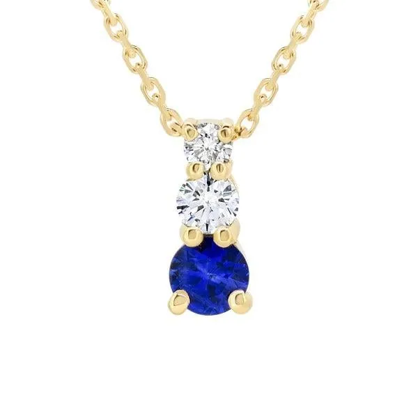 Pendentif en or jaune serti de diamants et saphir.