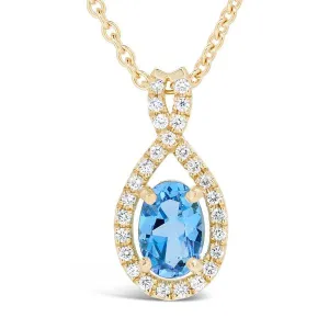 Pendentif en or jaune sertie d'une topaze et de diamants.