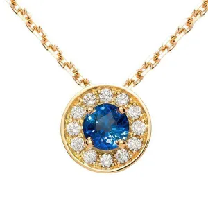 Pendentif entourage en or jaune serti d'un saphir et de diamants.