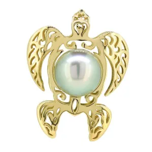 Pendentif tortue ajour en or jaune et perle de Tahiti.