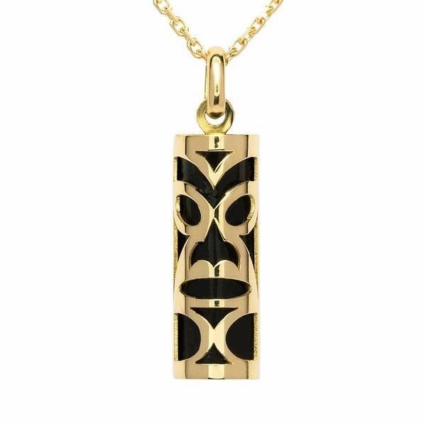 Pendentif tiki chambranle en or jaune. corail noir du lagon