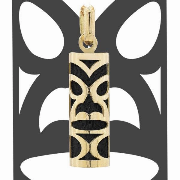Pendentif tiki chambranle en or jaune. corail noir du lagon