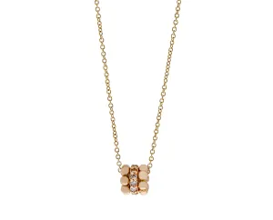 Rose gold and diamond necklace with a three ring pendant
