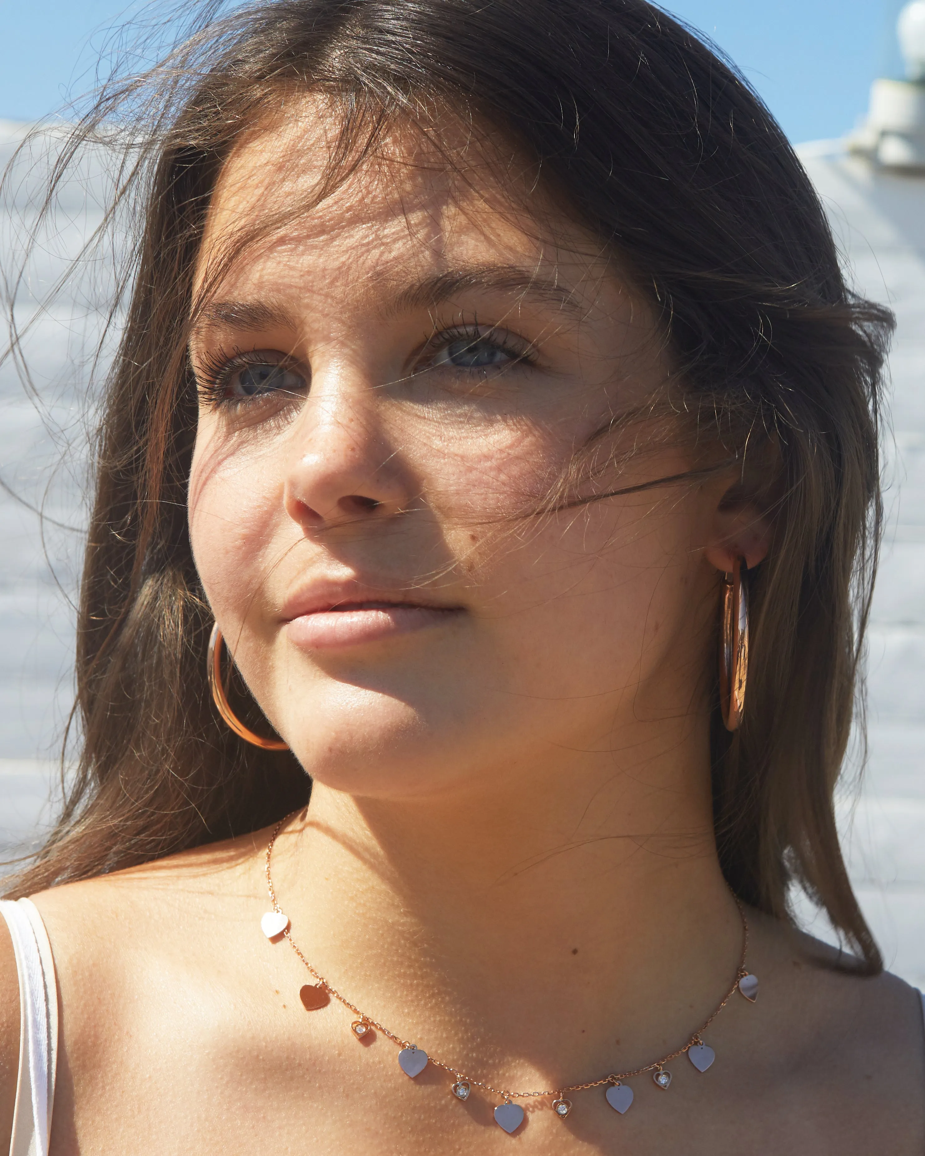 Rose gold necklace dangling hearts and diamonds