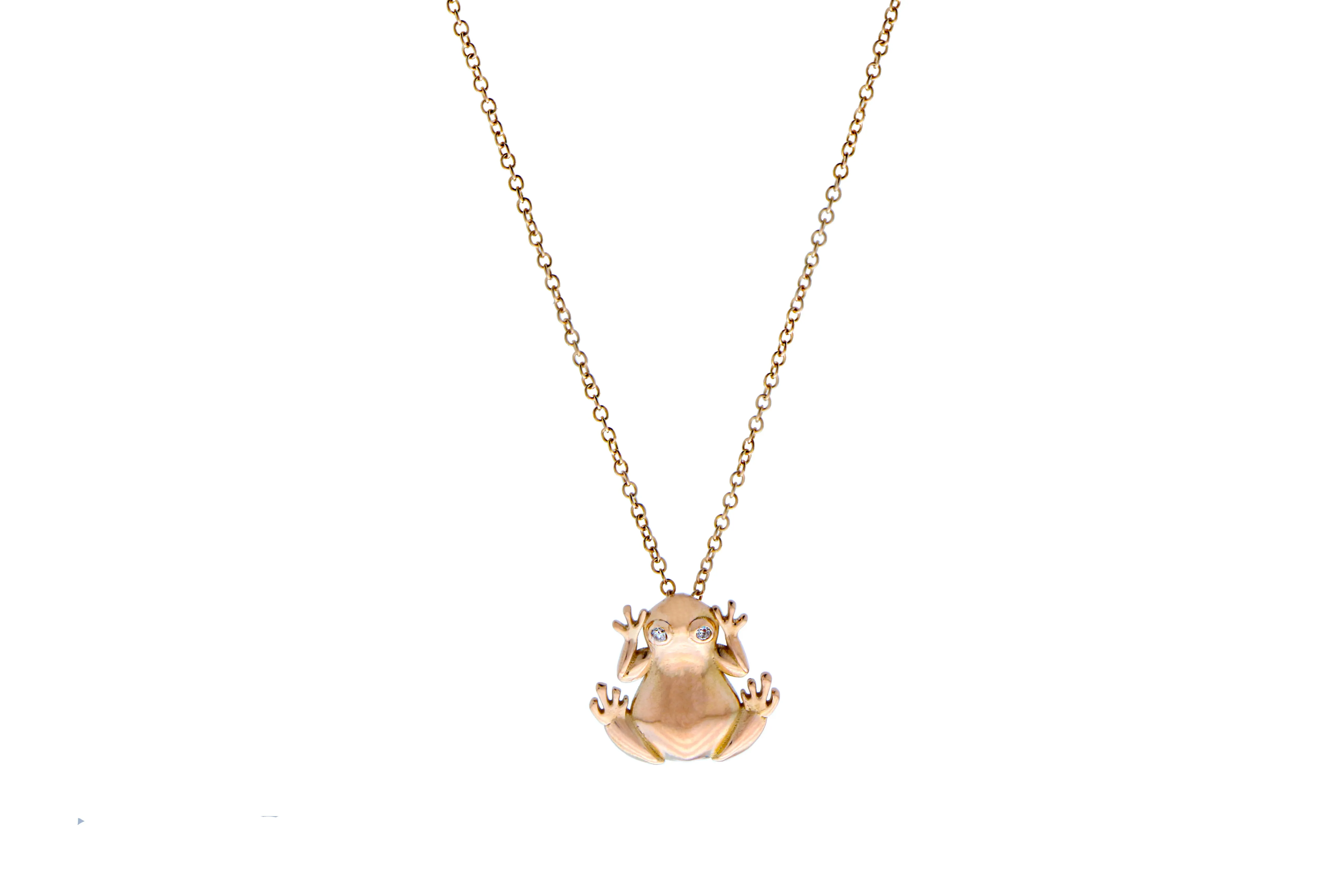 Rose gold necklace with a diamond eyed frog pendant