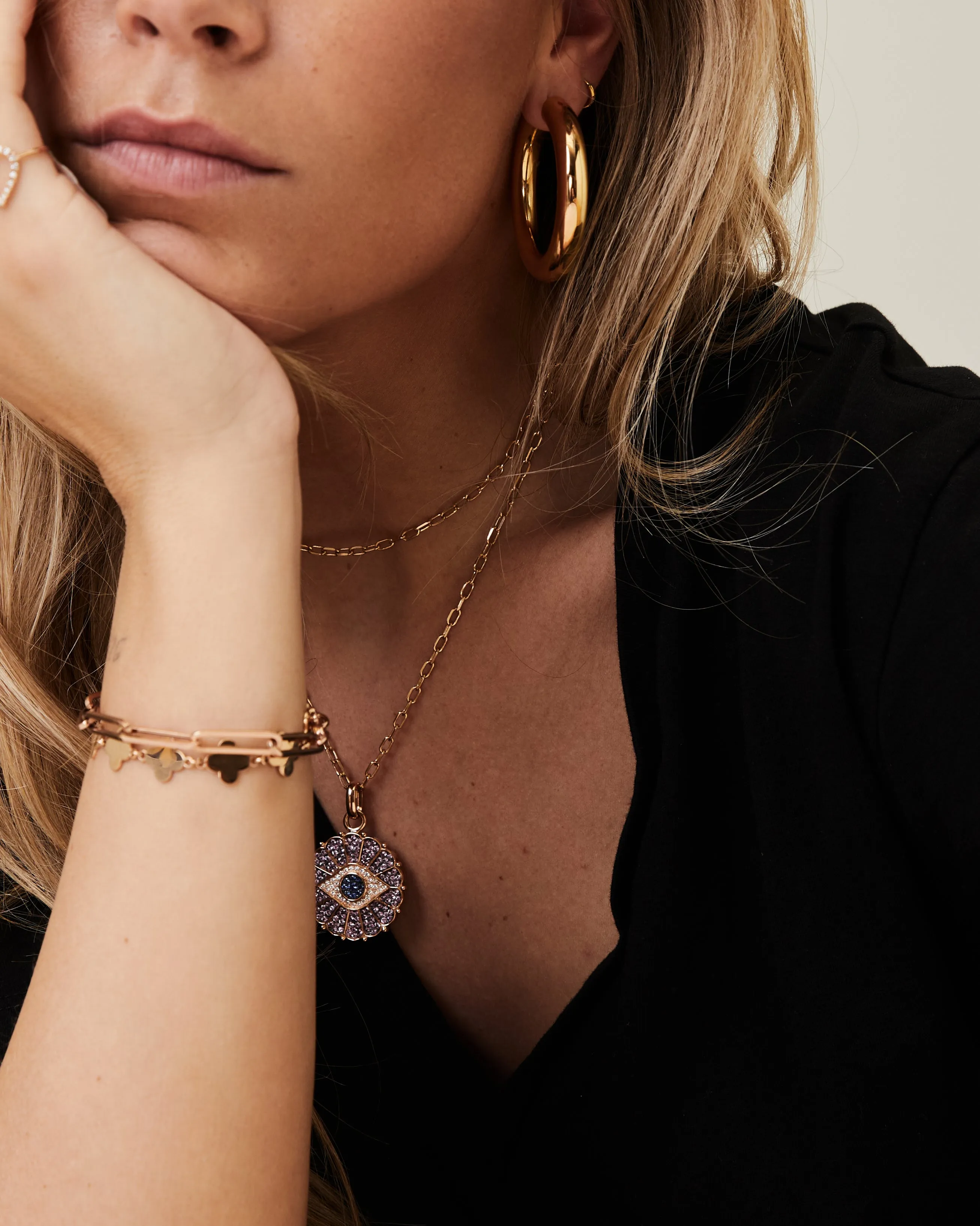 Rose gold sautoir with a pink and blue sapphire and diamond eye pendant