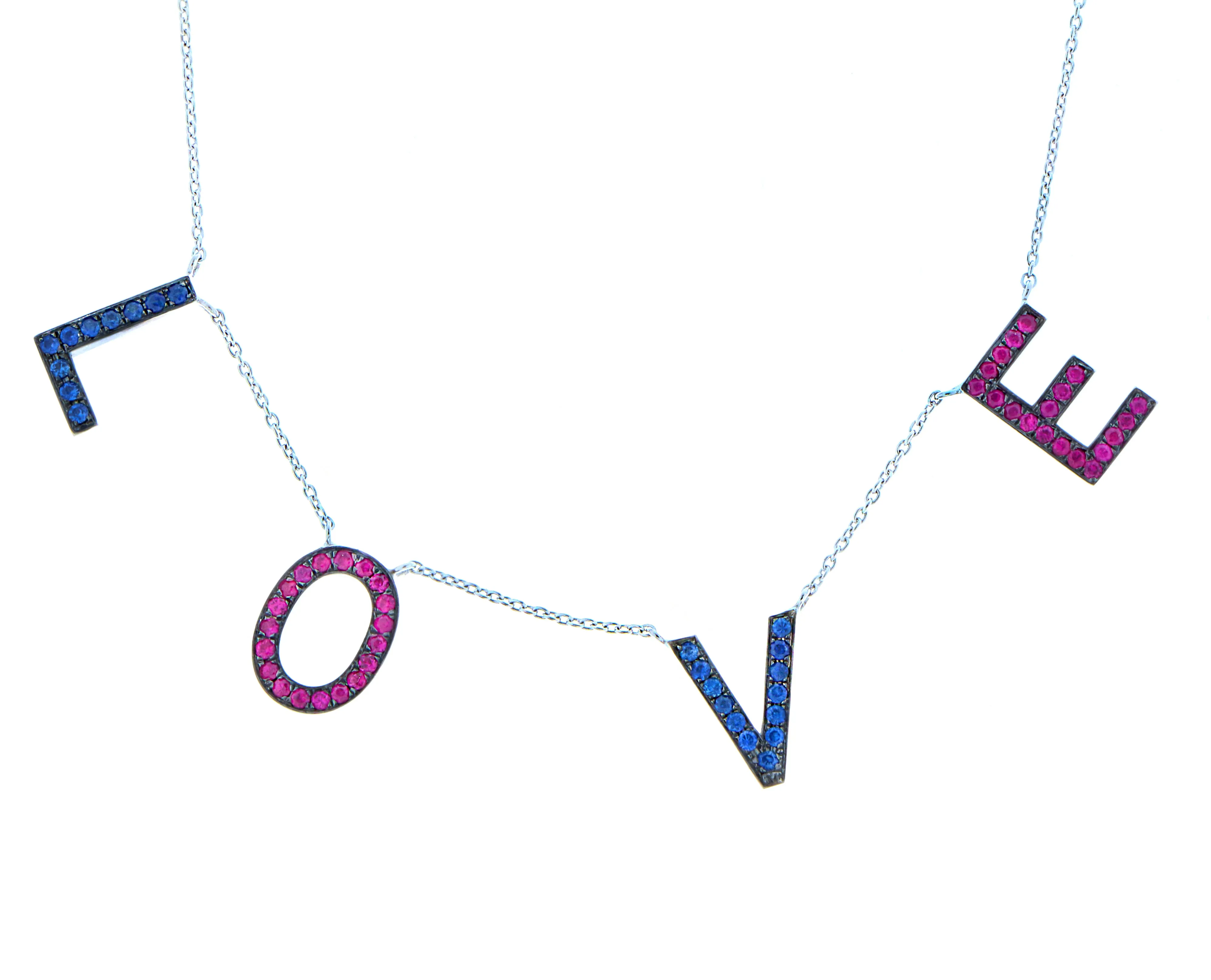 White gold letter necklace with rubies and sapphires