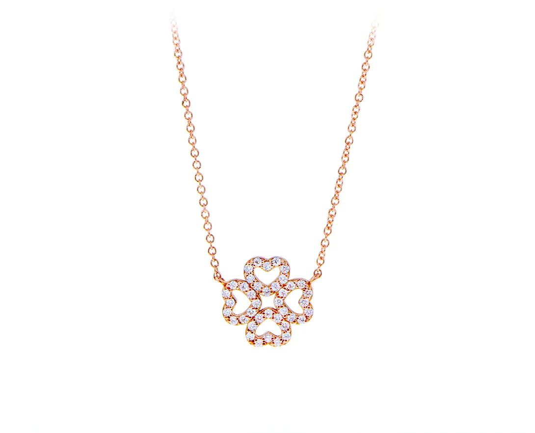 White or rose gold necklace with a diamond clover charm of hearts