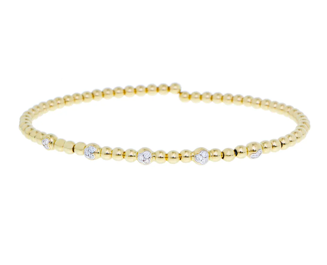 Yellow gold flexible ball bracelet with five diamond elements