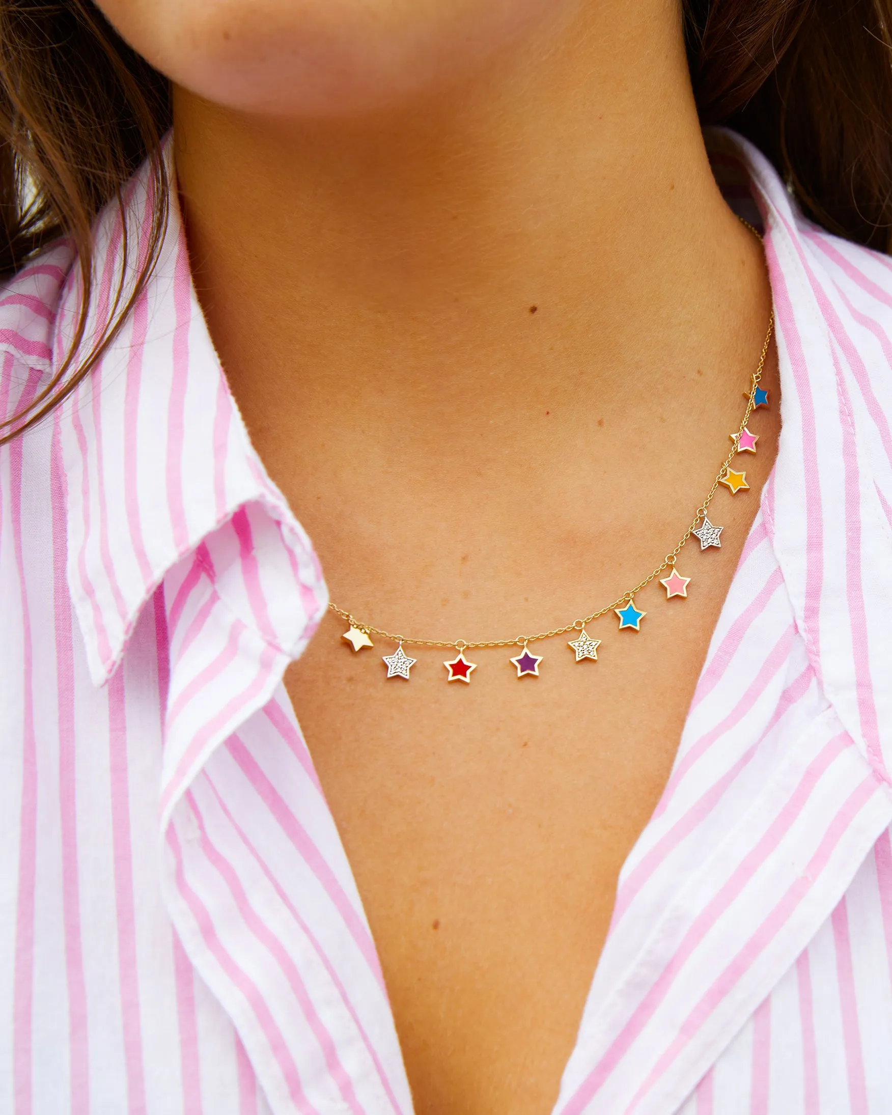 Yellow gold necklace with multi colored enamel and diamond star pendants