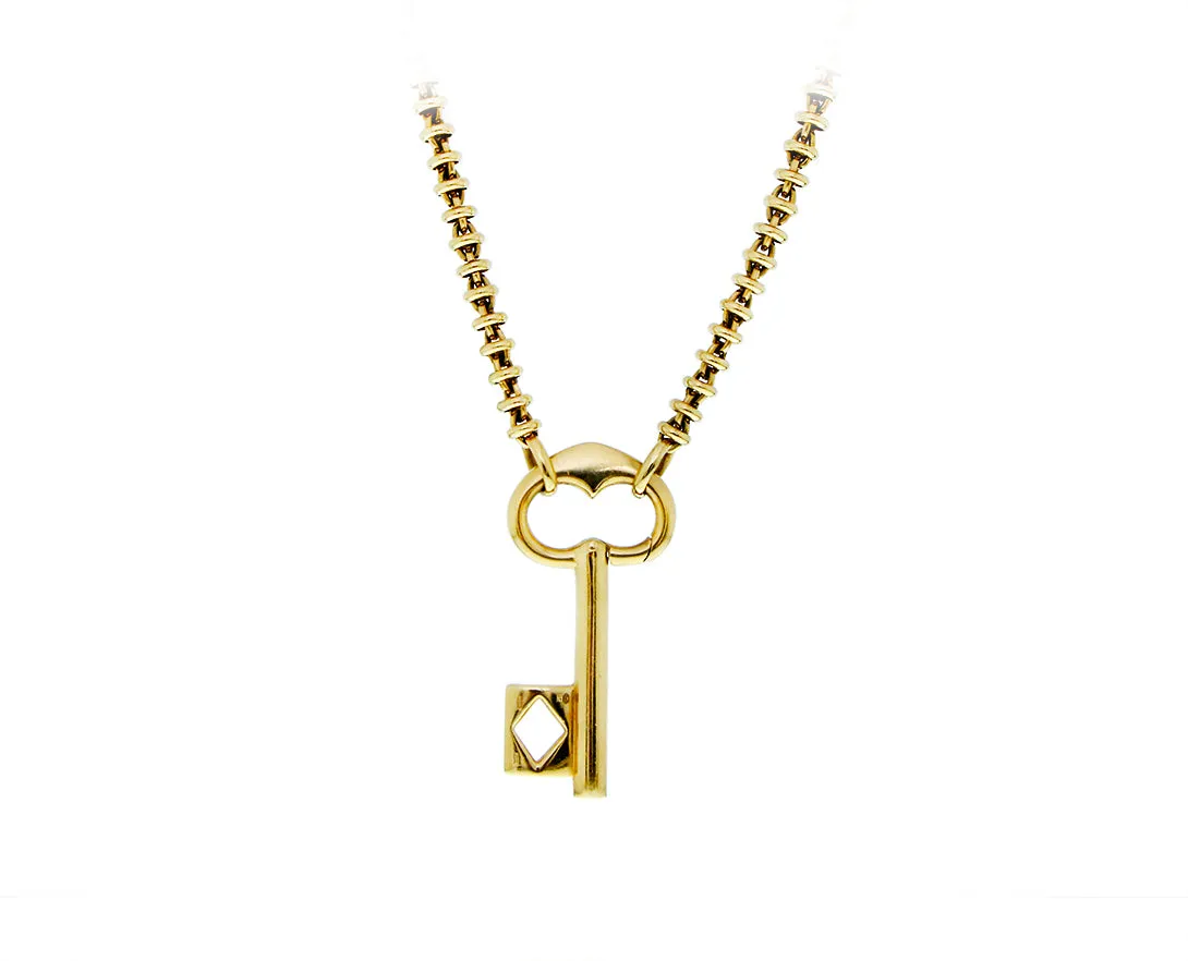 Yellow gold Pomellato necklace with key pendant