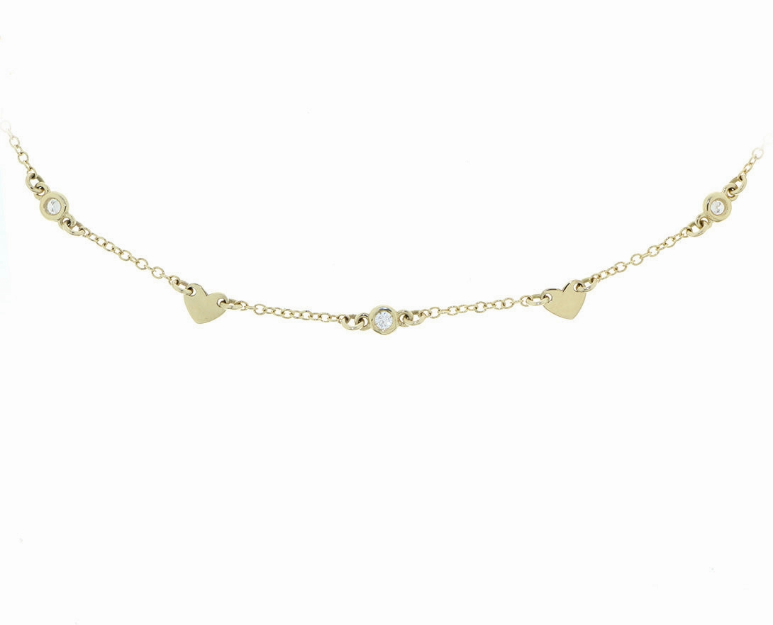 Yellow gold and diamond necklace with heart charms