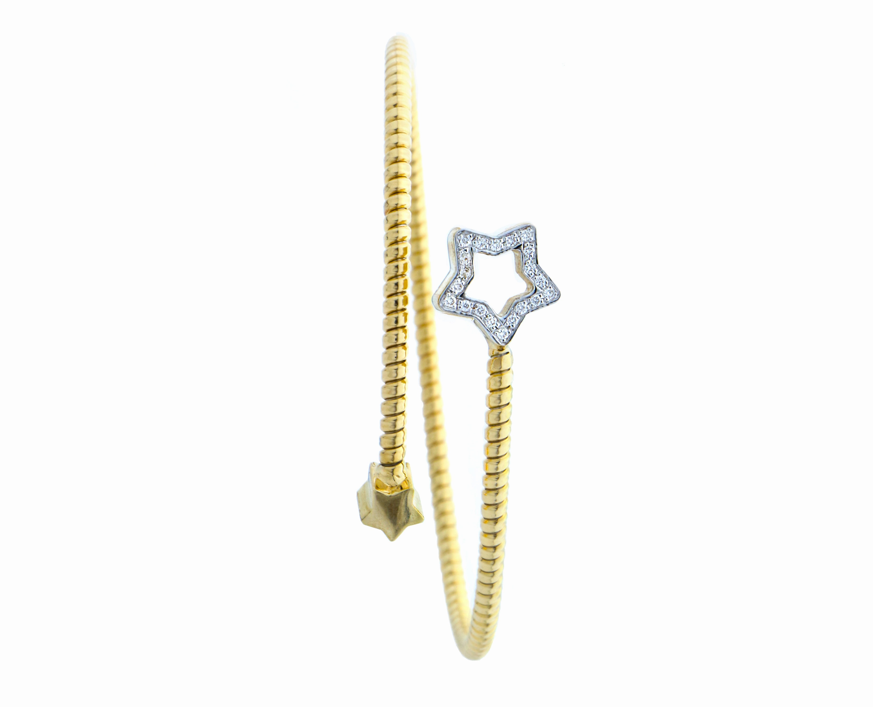Yellow gold tubo bangle bracelet with a diamond star