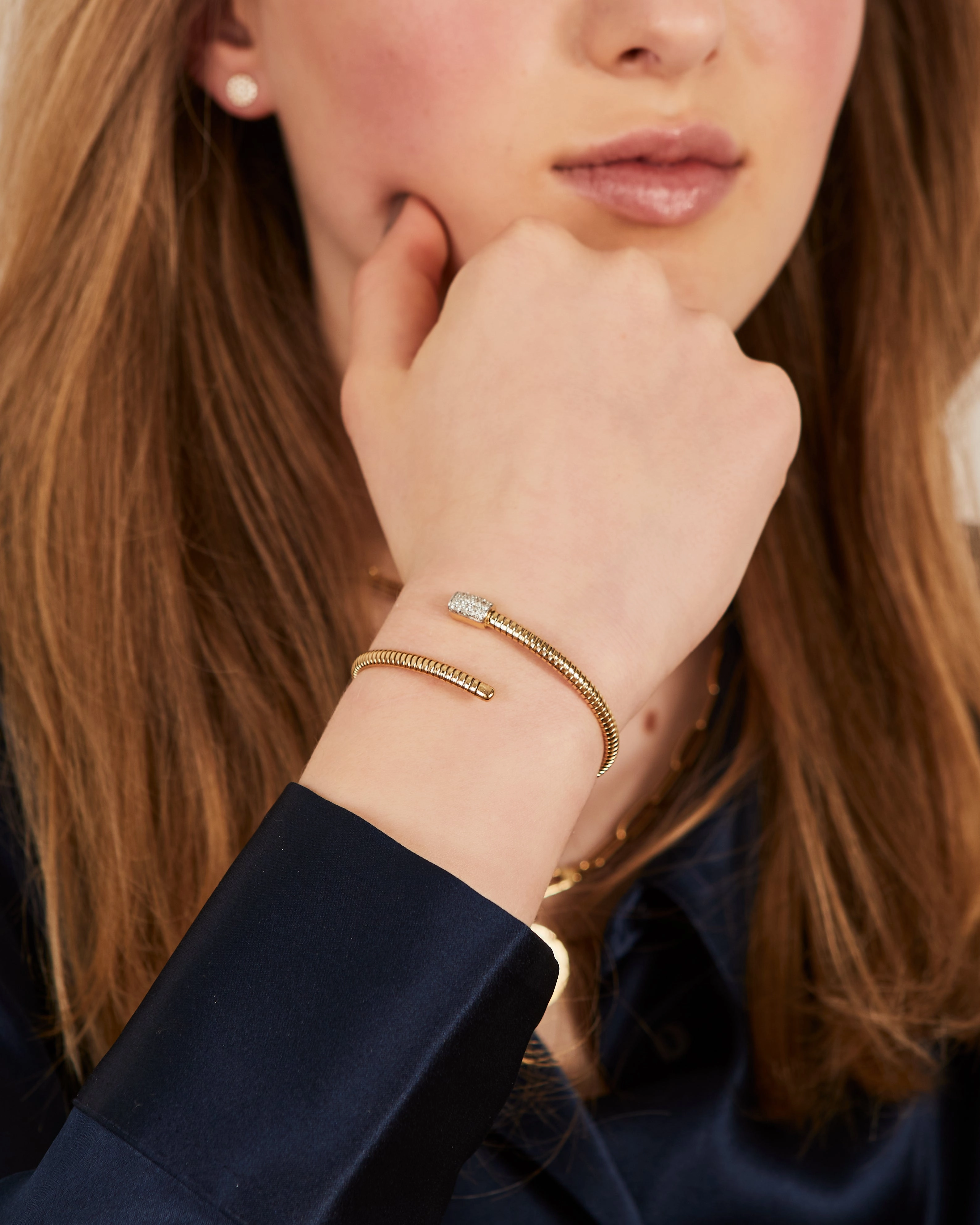 Yellow gold tubo bangle with a diamond rectangle